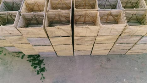 folded empty wooden boxes in warehouses, boxes are designed for harvesting fruits and vegetables