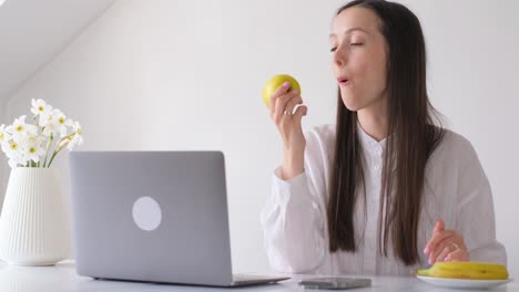 attractive brunette woman working from home via laptop young businesswoman sitting at office and attractive brunette woman working from home via laptop young businesswoman sitting at office and browsing internet