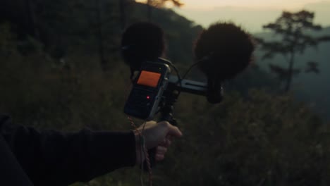 sound recording in the mountains at sunset