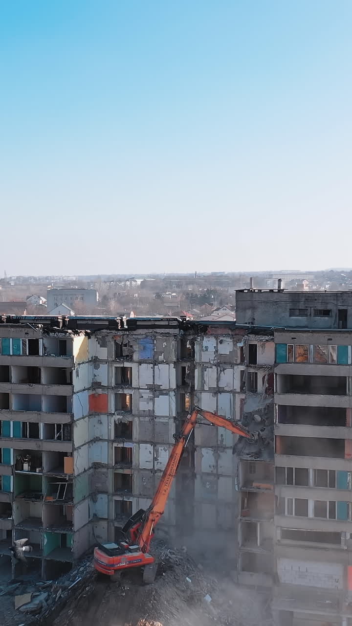 Excavator destroying building. Bulldozer constructive demolition.