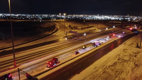 Drone-flight-over-a-snowy-highway-in-Toronto-where-emergency-services-provide-assistance-in-the-event-of-an-accident