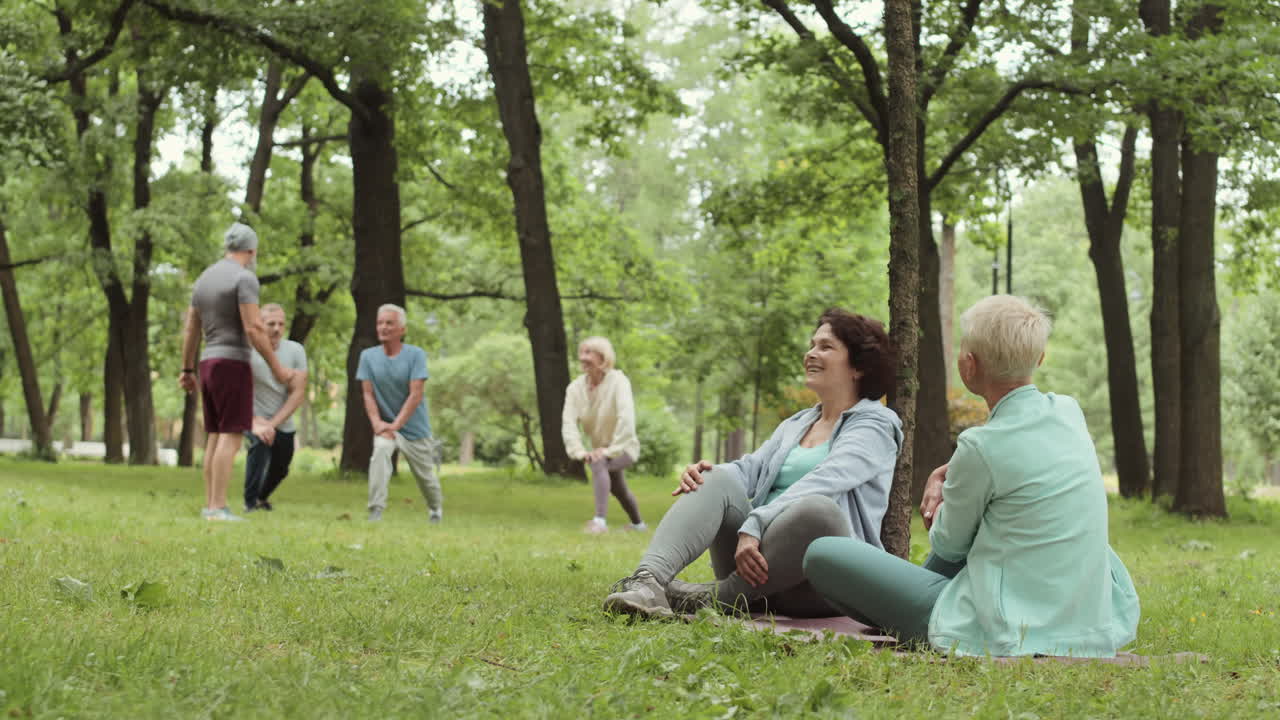 Seniors exercising in a park