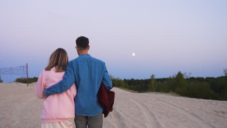 romantic couple in the sand