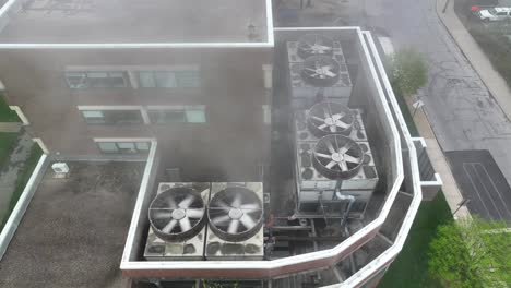 steam coming out of rooftop industrial units