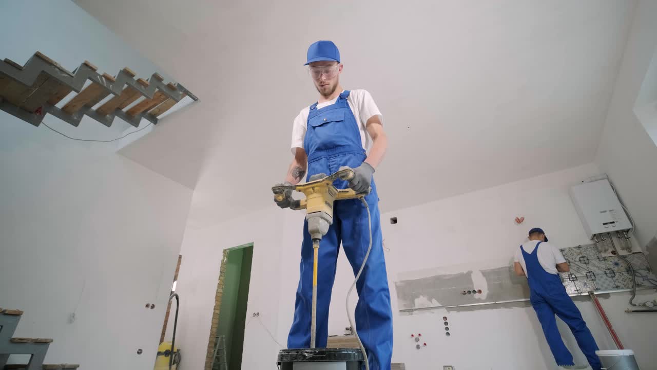 Installing ceramic floor tiles - measuring and cutting the pieces. Construction, renovation, repair apartment. Cuts tile. Tile cutting