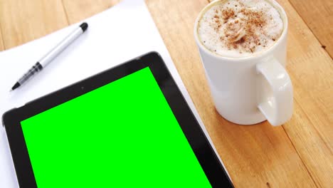 coffee with digital tablet and paper