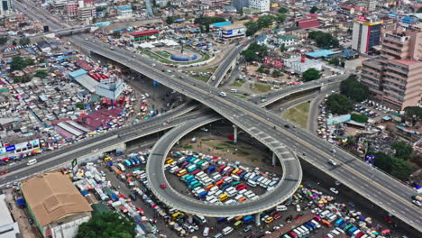 drone shot of moving traffic on a highway in accra