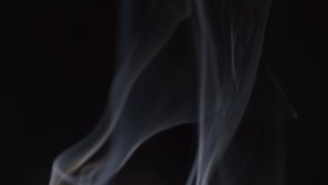 smoke swirling on dark background