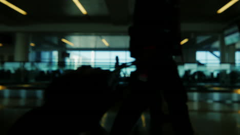 Silhouettes-of-passengers-in-the-airport-lounge-4