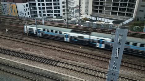 Train-running-on-railway,-La-Villette,-Paris-in-France