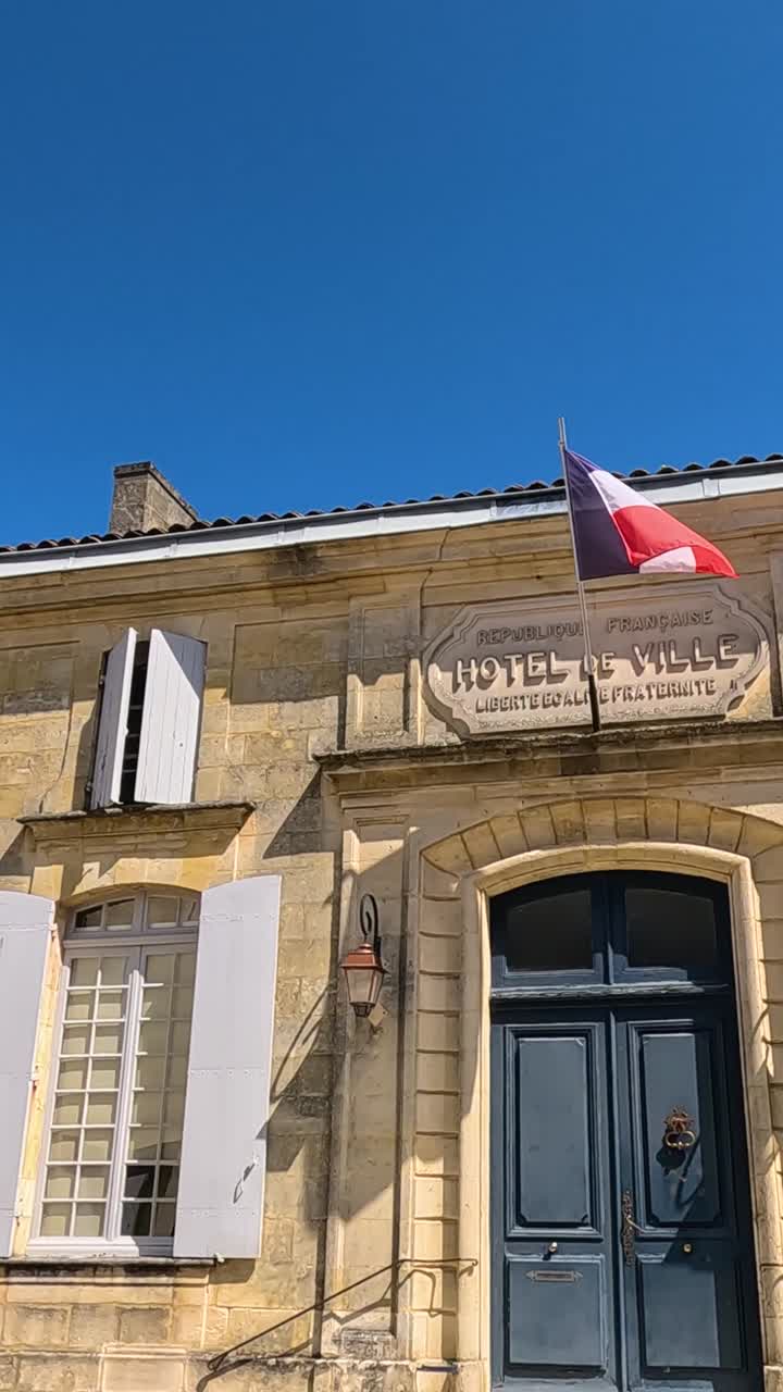 French flag on a historic building facade