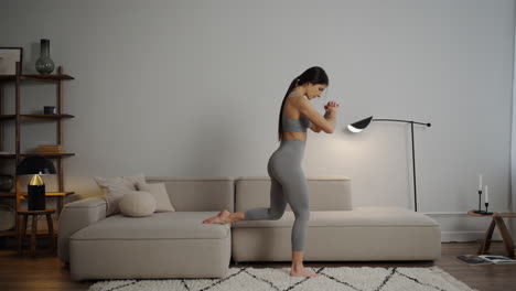 woman doing squats at home