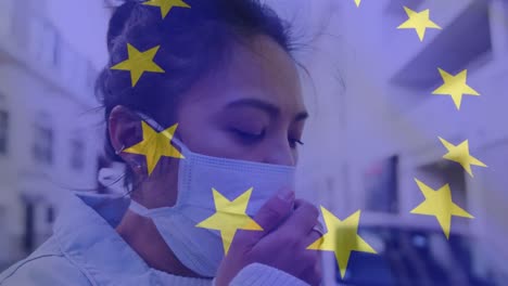 animation of flag of ue waving over woman in face masks