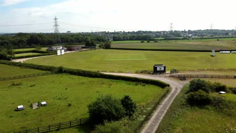 cricket ground and rural landscape with power lines