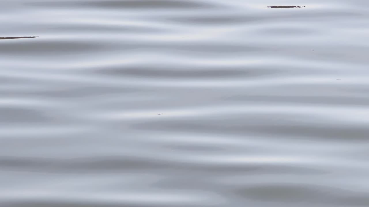 Detailed view of soft ripples creating a calming pattern on the water surface.