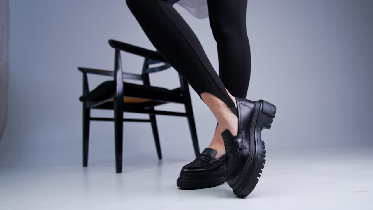 Stylish Black Platform Loafers on Woman