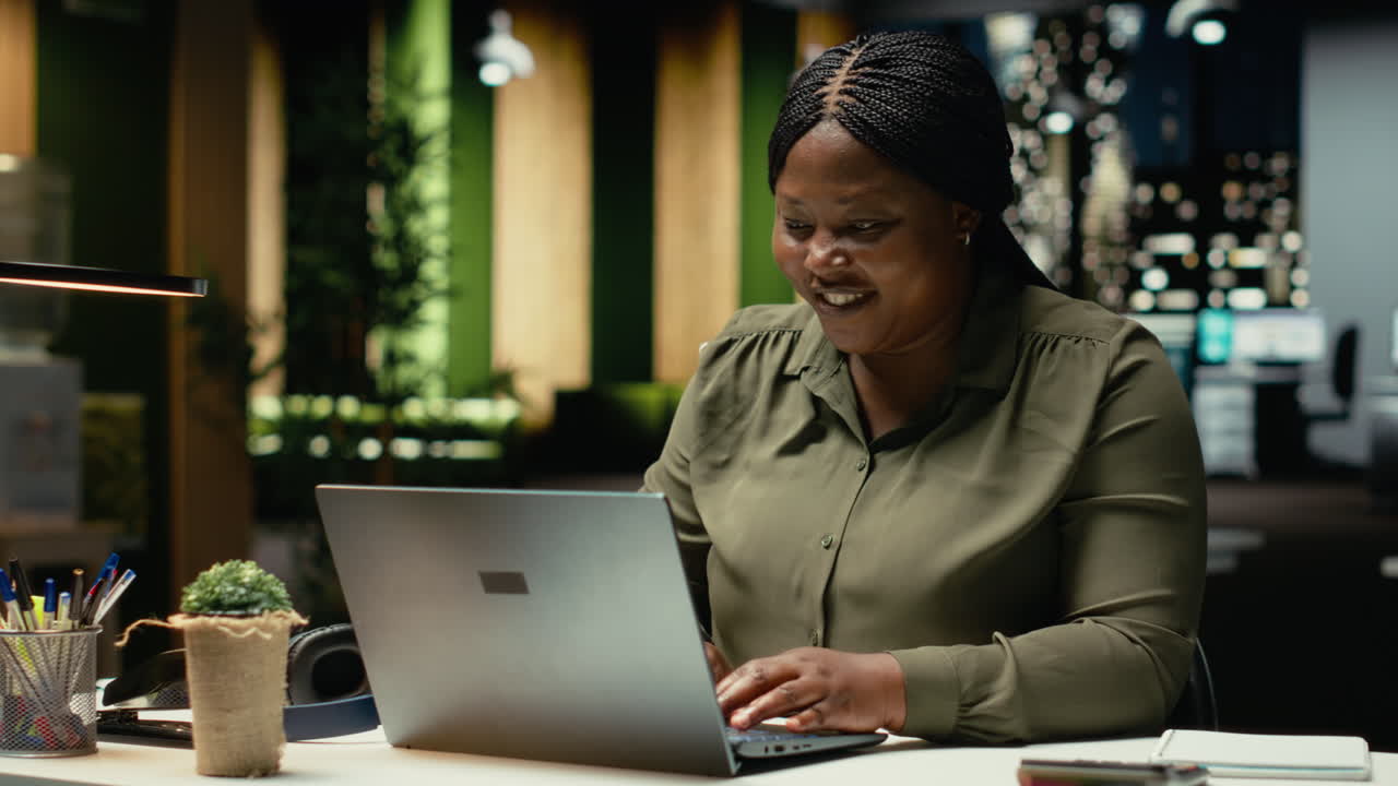 Black clever businesswoman getting a new idea and making a discovery at night