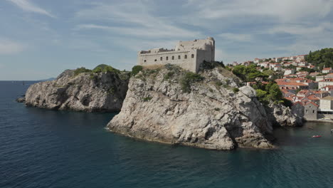 approaching parallax rotation drone shot around game of thrones filming location, king's landing and blackwater bay in dubrovnik, croatia.