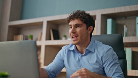 anxious businessman calling video conference in office. nervous man executive
