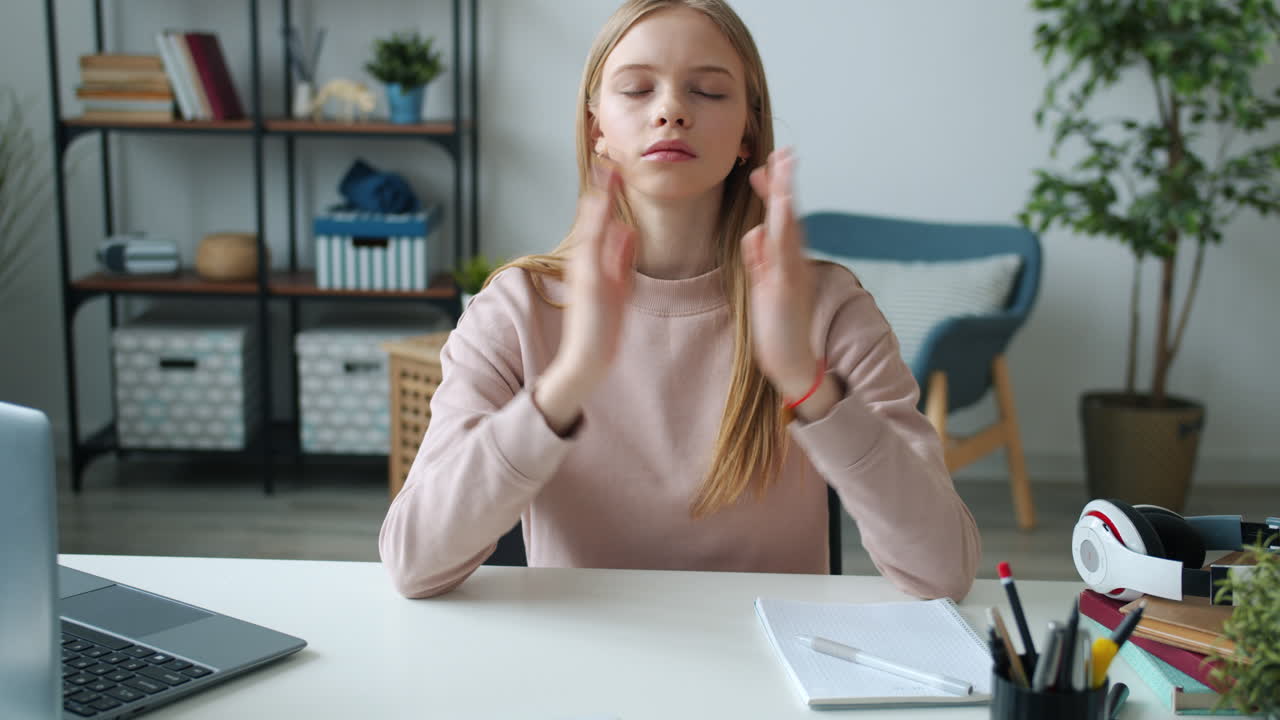 Teenage Girl Meditating While Studying