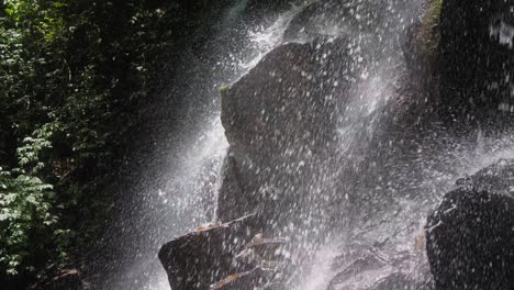 beautifully illuminated kanto lampo waterfall in bali, indonesia