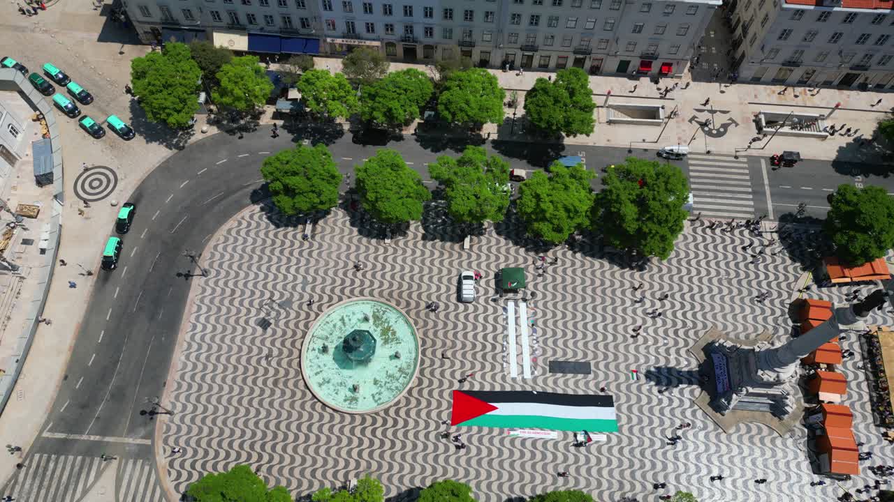 Aerial View of a City Square with Palestinian Flag