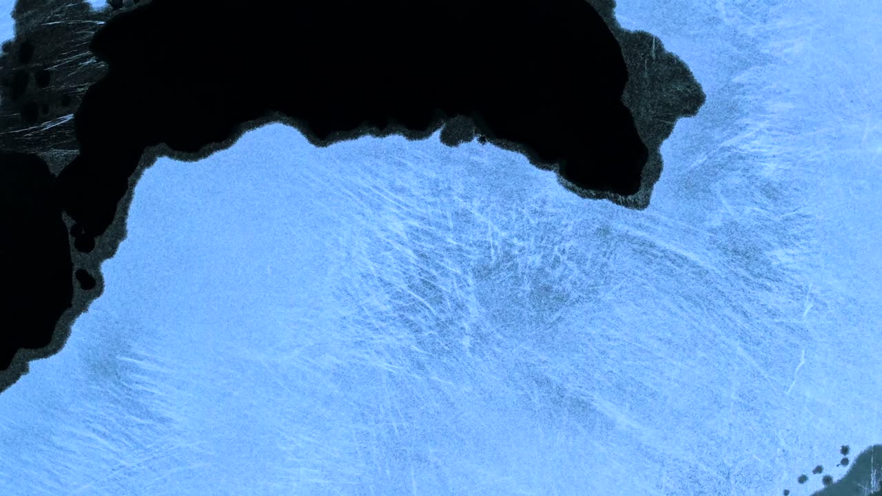 Melting black ice, frozen lake surface, European weather, overhead view