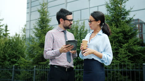 business people discussing project outdoors