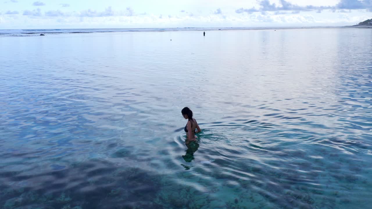 Female Tourist On Secluded Beach Of Gunung Payung In Bali, Indonesia