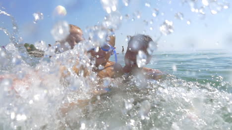 Exciting-sea-bathing-of-happy-family