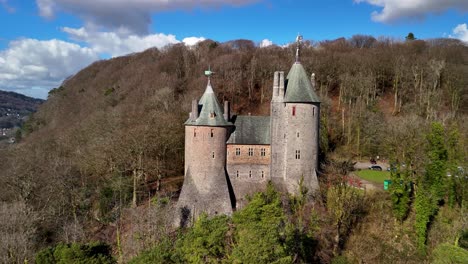 stunning drone footage of castell coch near cardiff, showcasing its fairytale architecture, lush woodland setting, and historic charm through cinematic aerial and scenic shots.