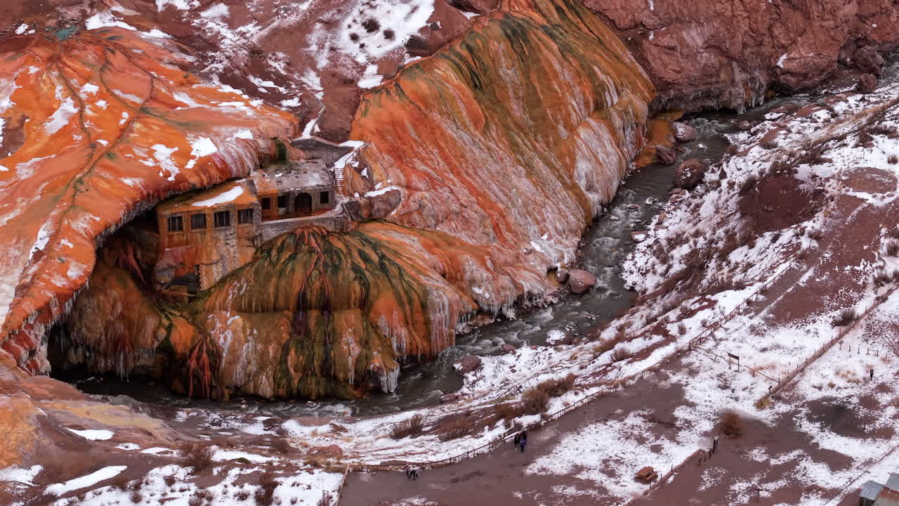 Aerial view of Puente del Inca natural rock formation in Mendoza Argentina covered with snow
