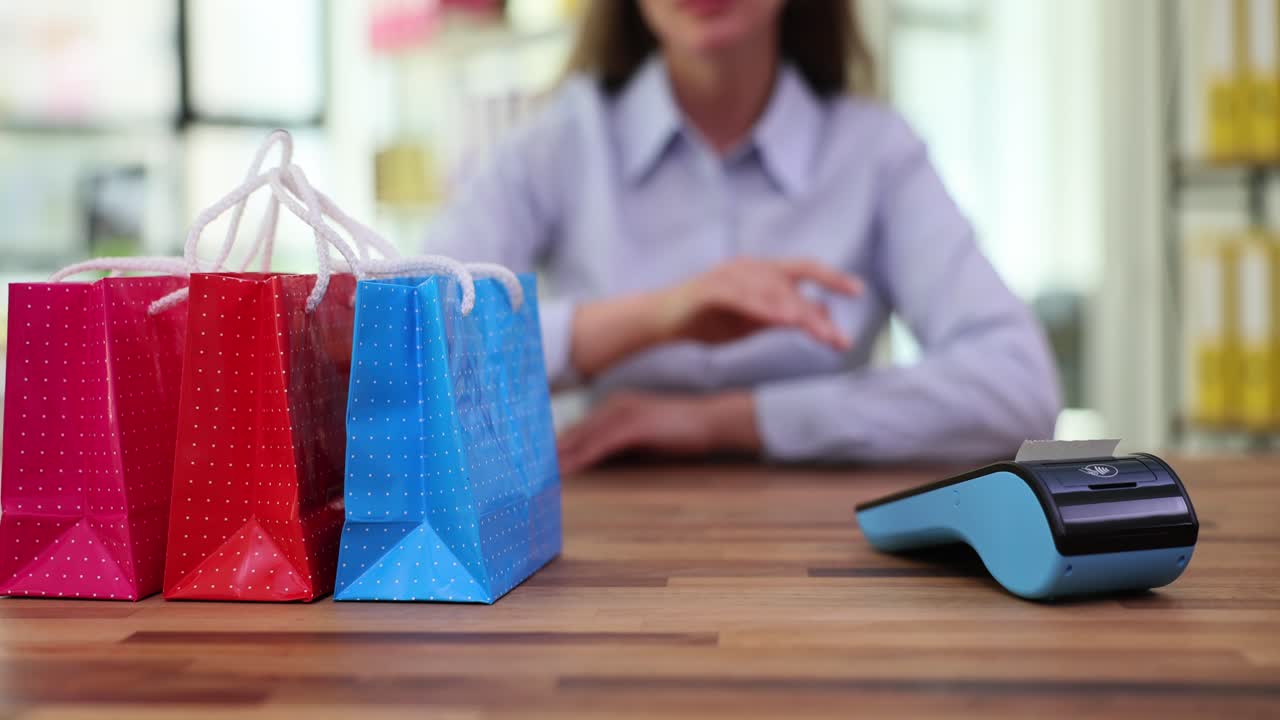 Customer receives shopping bags and completes a purchase