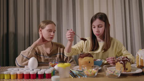 children decorating easter bread