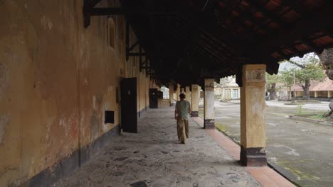 woman sightseeing the ancient prison camp in con dao, ba ria vung tau in vietnam