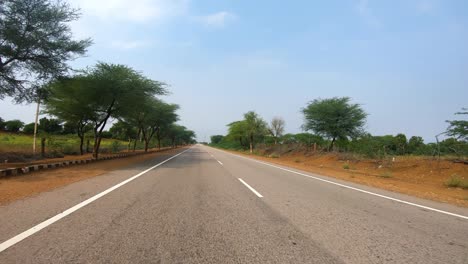 driving a car on a road in rajasthan india