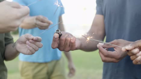 closeup shot of burning sparklers in hands