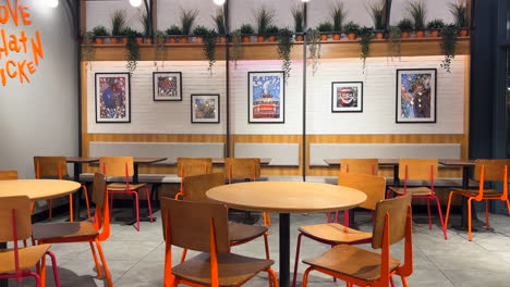 popeyes louisiana kitchen famous american fried chicken fast food chain restaurant, chairs and tables, 4k shot