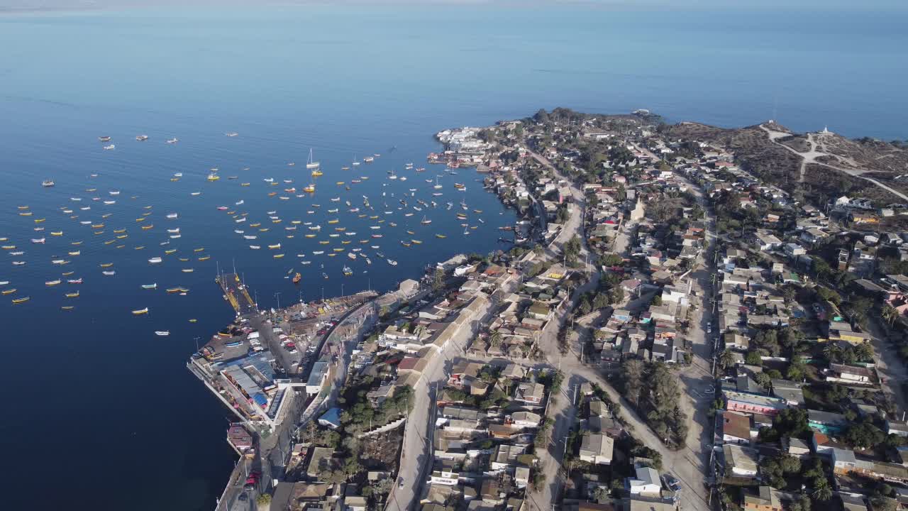 Boats moored in harbour marina of quaint fishing village, Tongoy Chile