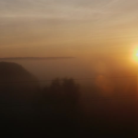 The-Rising-Sun-From-The-Window-Of-A-Moving-Train-Or-Car