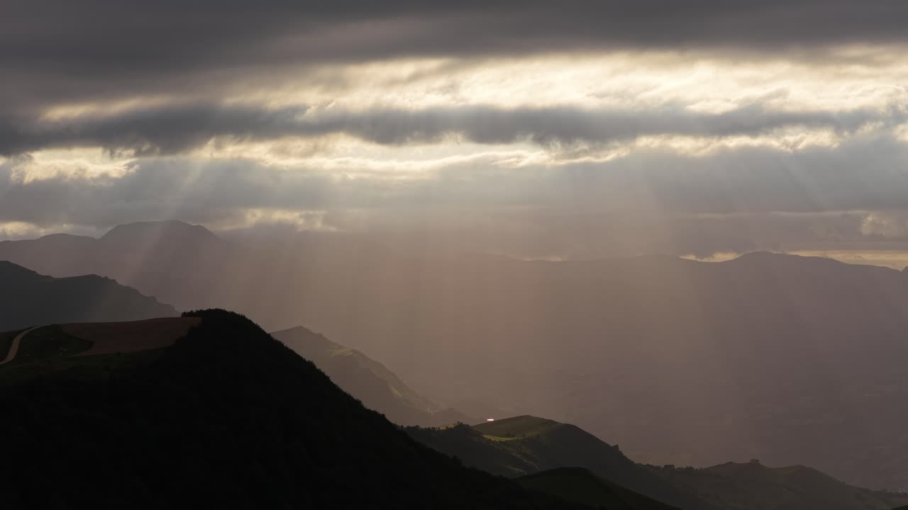 Majestic sunlight piercing through clouds over cantabrian mountains