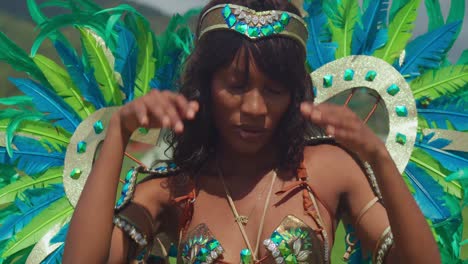 Against-the-backdrop-of-Trinidad's-palm-fringed-beaches,-a-young-girl-in-carnival-dress-captivates-onlookers-with-her-graceful-movements