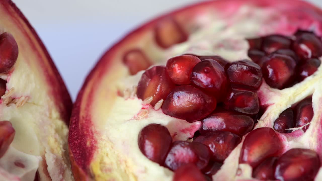 Pomegranate fruit seeds and peel rotation macro