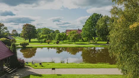 elevated elegance: unique drone view of reflecting pond and lakehouse