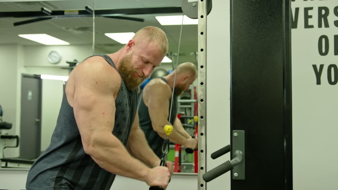 Muscular bodybuilder handsome men doing exercises in gym