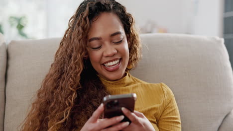 smiling young woman looking at her phone