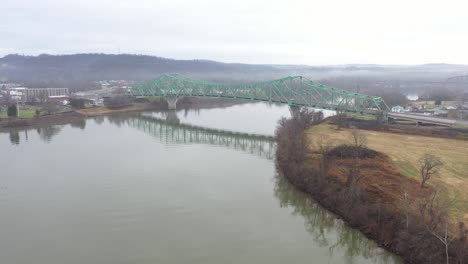 Aerial-Flying-in-towards-Green-Bridge