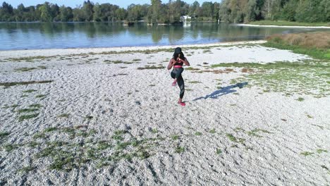 Drone-shot-of-young-attractive-black-female-doing-sports-outdoors