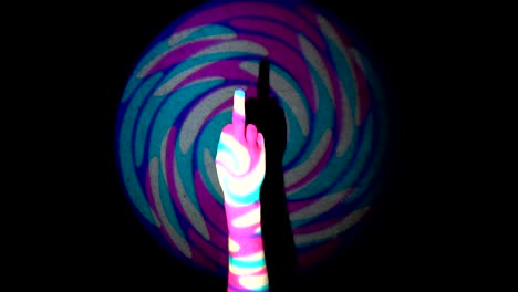 hand making obscene gesture by showing middle finger on colorful tunnel flythrough loop background