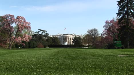 a long shot of the white house and its beautifully landscaped yard